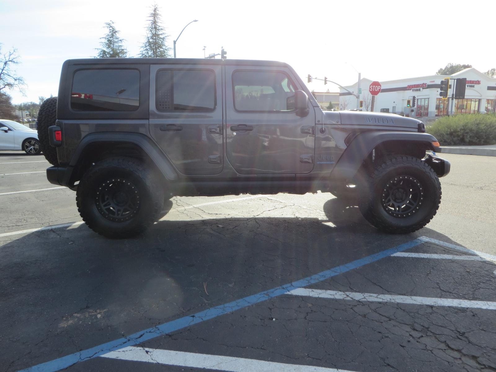 2023 CHARCOAL /black Jeep Wrangler Unlimited Willys 4XE (1C4JJXN68PW) with an 2.0L L4 DOHC 16V HYBRID engine, 8A transmission, located at 2630 Grass Valley Highway, Auburn, CA, 95603, (530) 508-5100, 38.937893, -121.095482 - 3" Zone Offroad lift kit, Fox Adventure series shocks, 17" Method Race wheels, 37" BFG KO2 tires, and a Teraflex spare tire carrier. - Photo #3